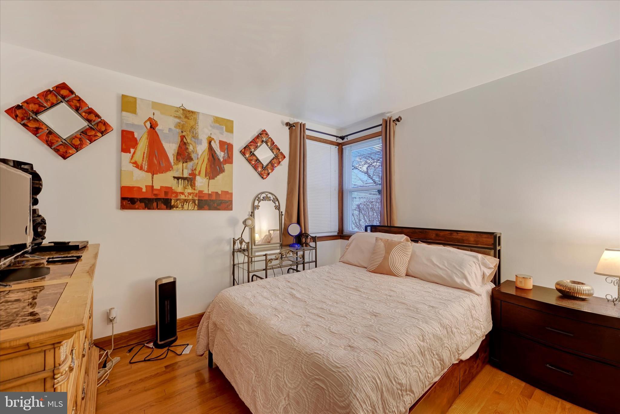 1813 Hanford Road Rosedale, MD 21237 - Photo 15 of 39 a bedroom with a bed and wooden floor