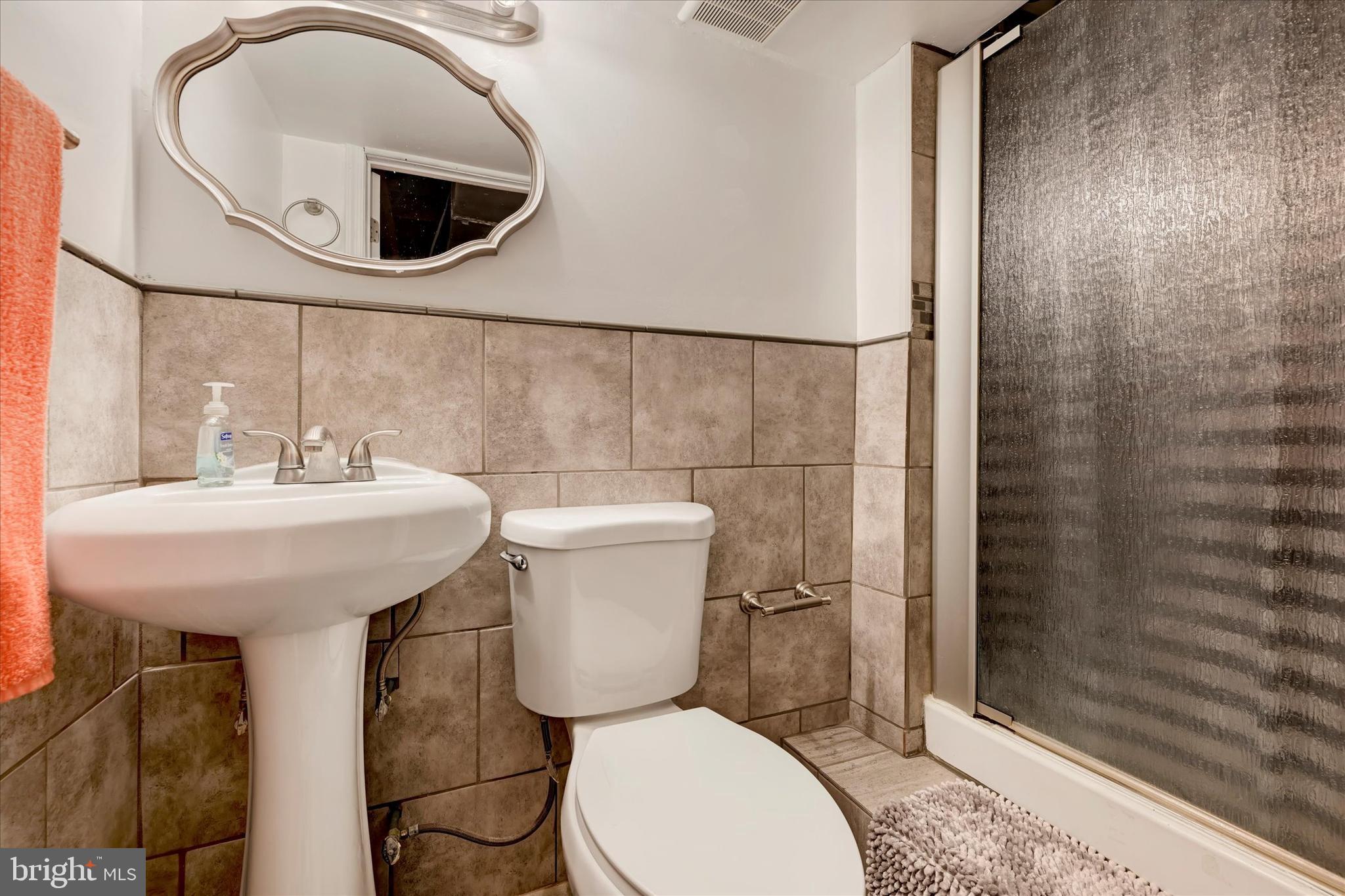 1813 Hanford Road Rosedale, MD 21237 - Photo 23 of 39 a bathroom with a sink toilet and shower