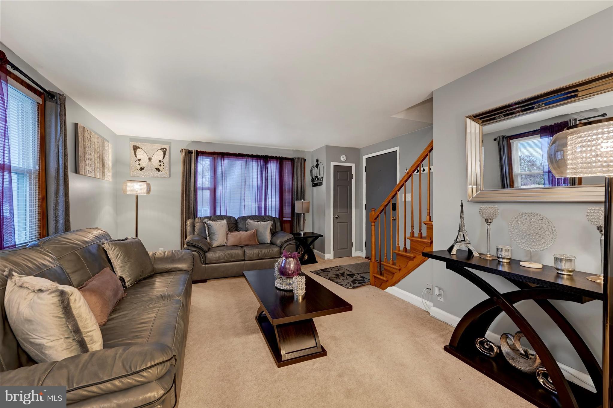 1813 Hanford Road Rosedale, MD 21237 - Photo 4 of 39 a living room with furniture gym equipment and a window