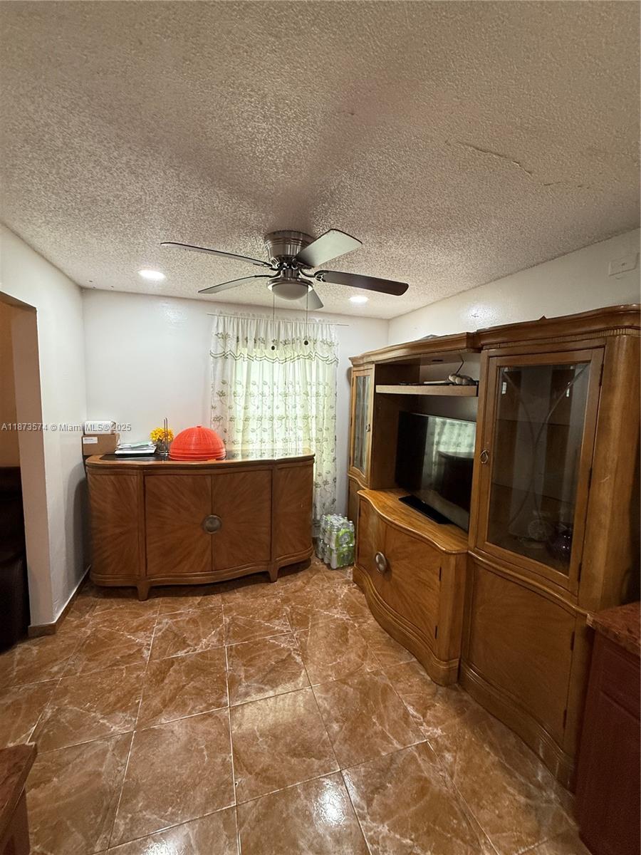 769 Southwest 8th Terrace Florida City, FL 33034 - Photo 19 of 25 a living room with a flat screen tv