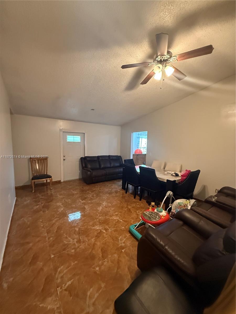 769 Southwest 8th Terrace Florida City, FL 33034 - Photo 20 of 25 a living room with furniture and a ceiling fan