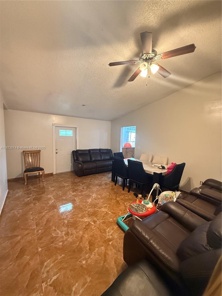 769 Southwest 8th Terrace Florida City, FL 33034 - Photo 21 of 25 a living room with furniture and a ceiling fan