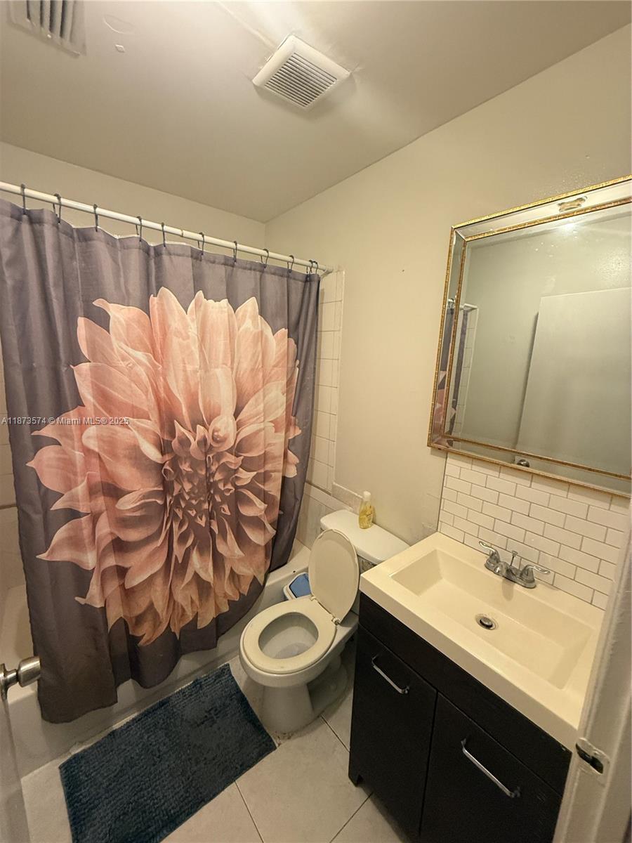 769 Southwest 8th Terrace Florida City, FL 33034 - Photo 22 of 25 a bathroom with a sink mirror vanity and toilet