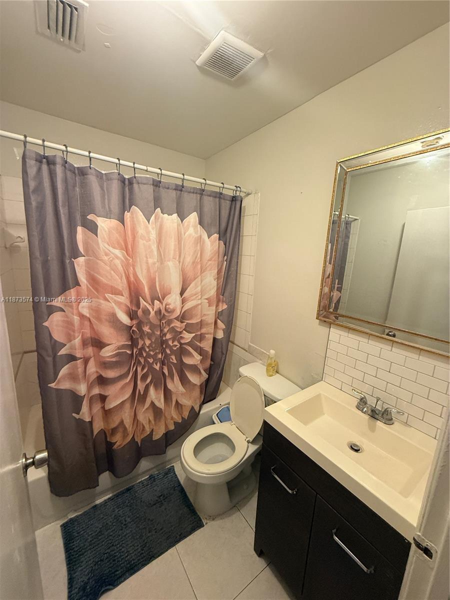 769 Southwest 8th Terrace Florida City, FL 33034 - Photo 23 of 25 a bathroom with a sink mirror vanity and toilet