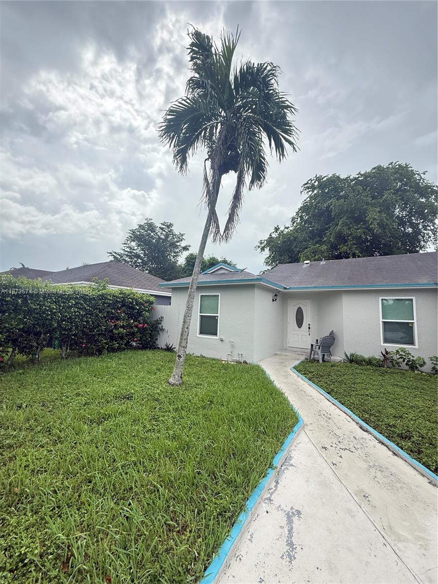 769 Southwest 8th Terrace Florida City, FL 33034 - Photo 3 of 25 front view of a house with a yard