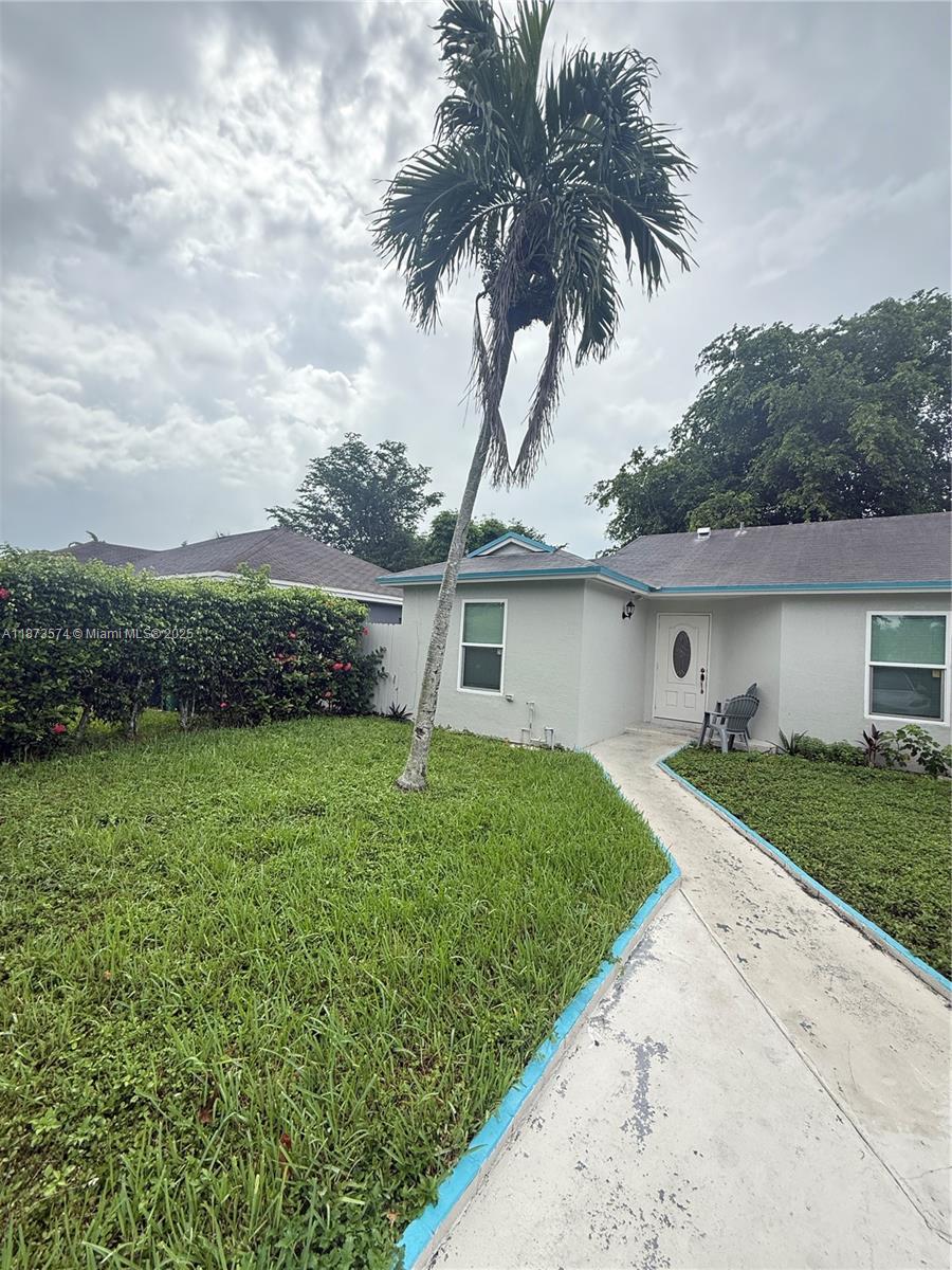 769 Southwest 8th Terrace Florida City, FL 33034 - Photo 4 of 25 front view of a house with a yard