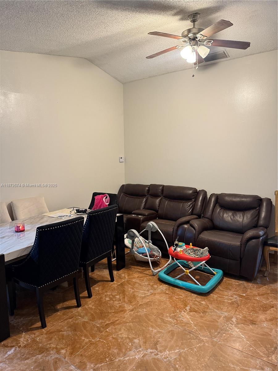 769 Southwest 8th Terrace Florida City, FL 33034 - Photo 6 of 25 a living room with furniture a air conditioner and a window