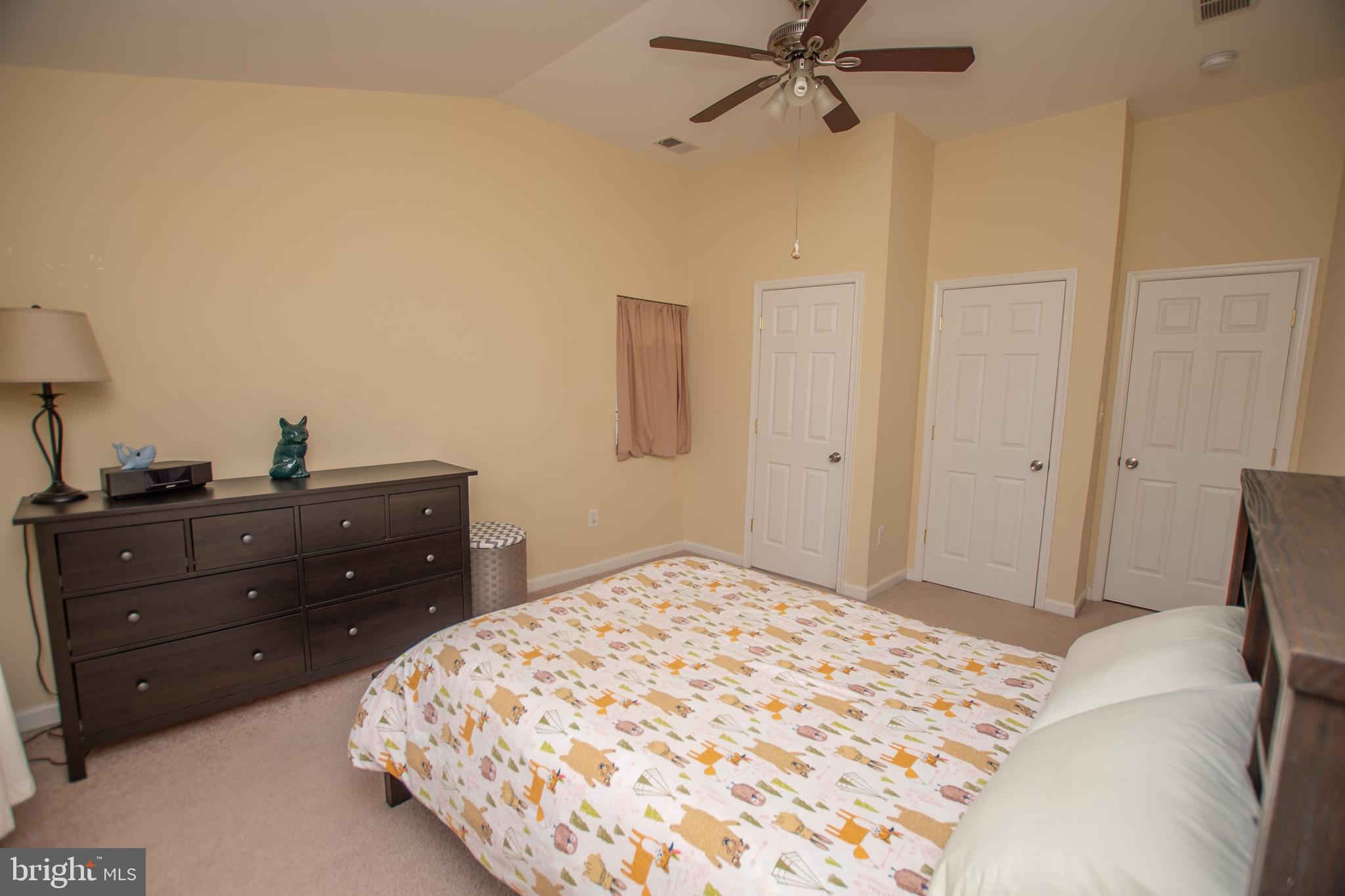 67 Edmondson Ridge Road Baltimore, MD 21228 - Photo 9 of 41 a bedroom with a bed and a dresser