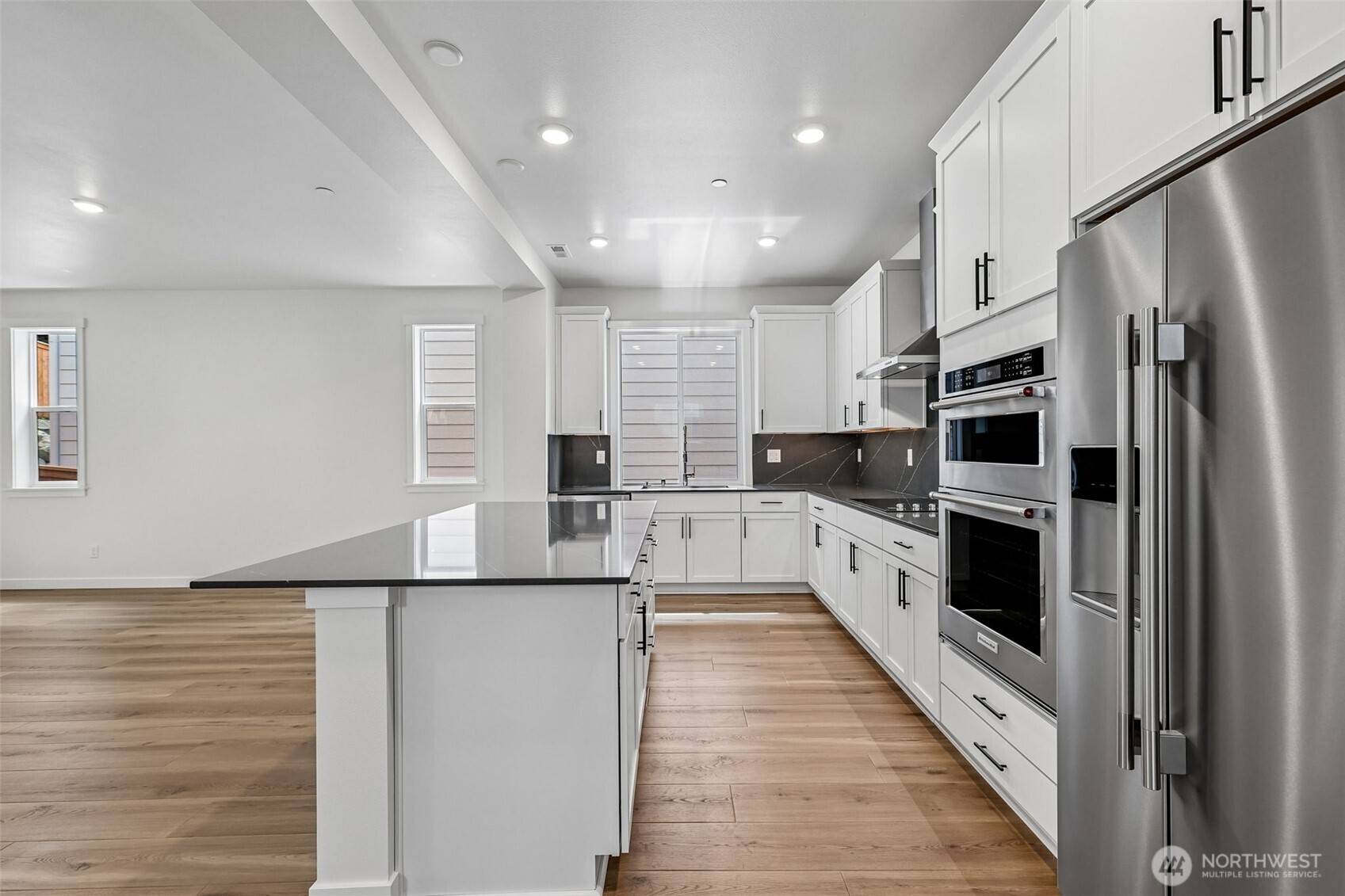24229 13 Avenue Southeast, Unit CR27 Bothell, WA 98021 - Photo 13 of 40 a large kitchen with a large window and stainless steel appliances