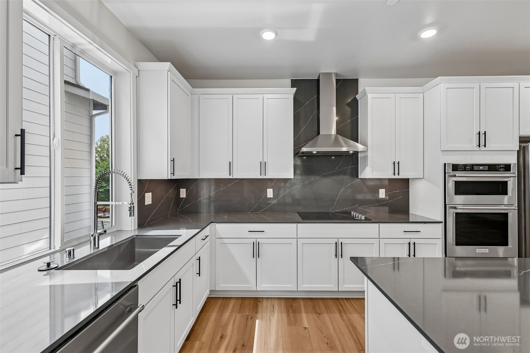 24229 13 Avenue Southeast, Unit CR27 Bothell, WA 98021 - Photo 14 of 40 a kitchen with stainless steel appliances granite countertop a sink stove and refrigerator