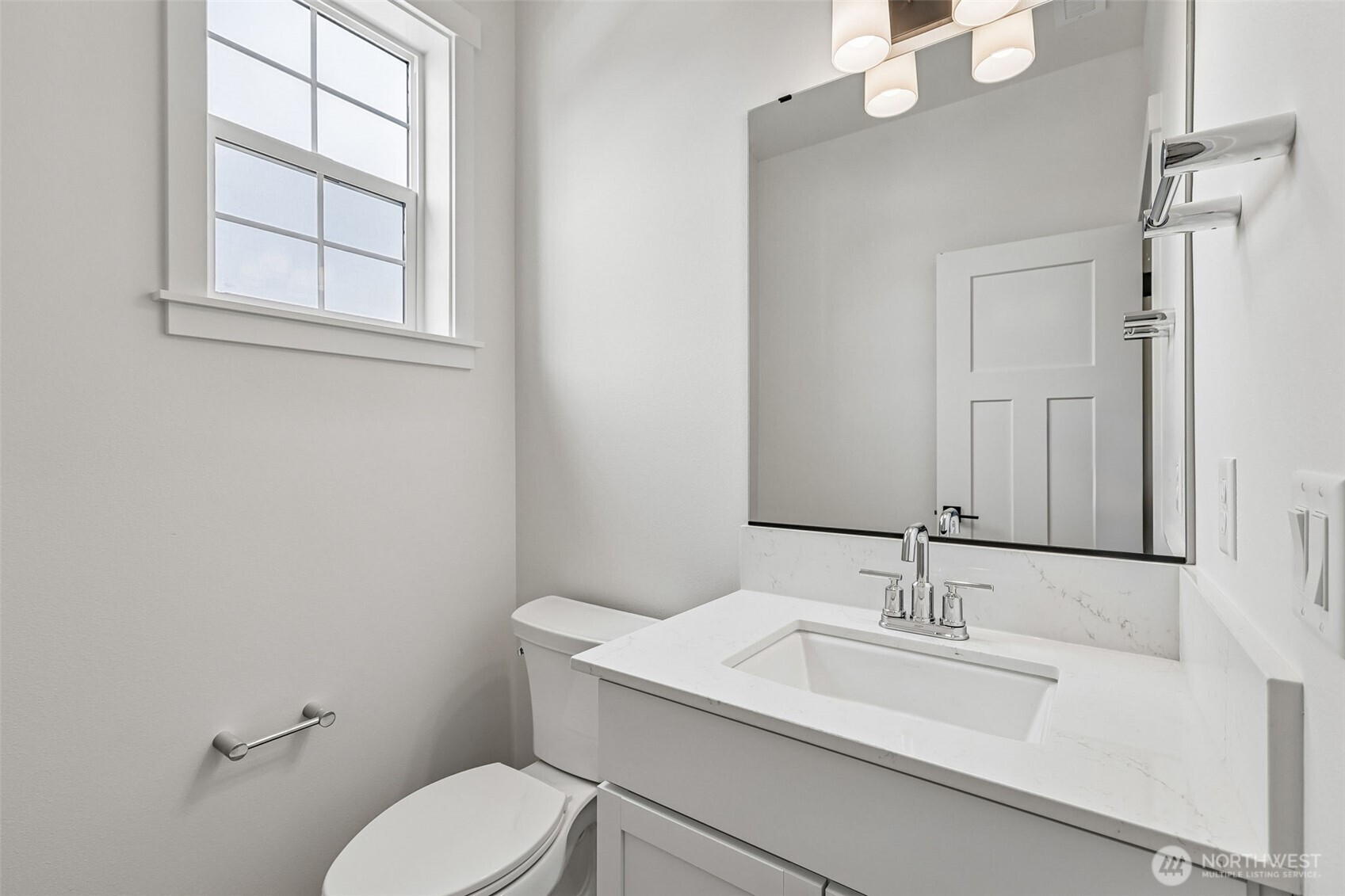 24229 13 Avenue Southeast, Unit CR27 Bothell, WA 98021 - Photo 19 of 40 a bathroom with a toilet sink vanity and mirror
