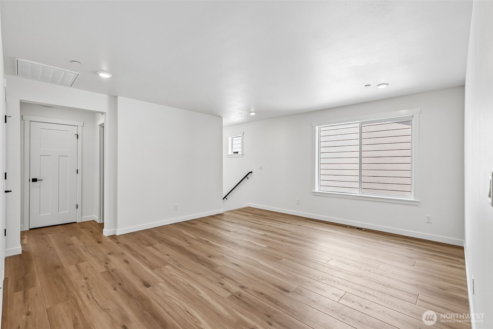 24229 13 Avenue Southeast, Unit CR27 Bothell, WA 98021 - Photo 21 of 40 a view of empty room with wooden floor and fan