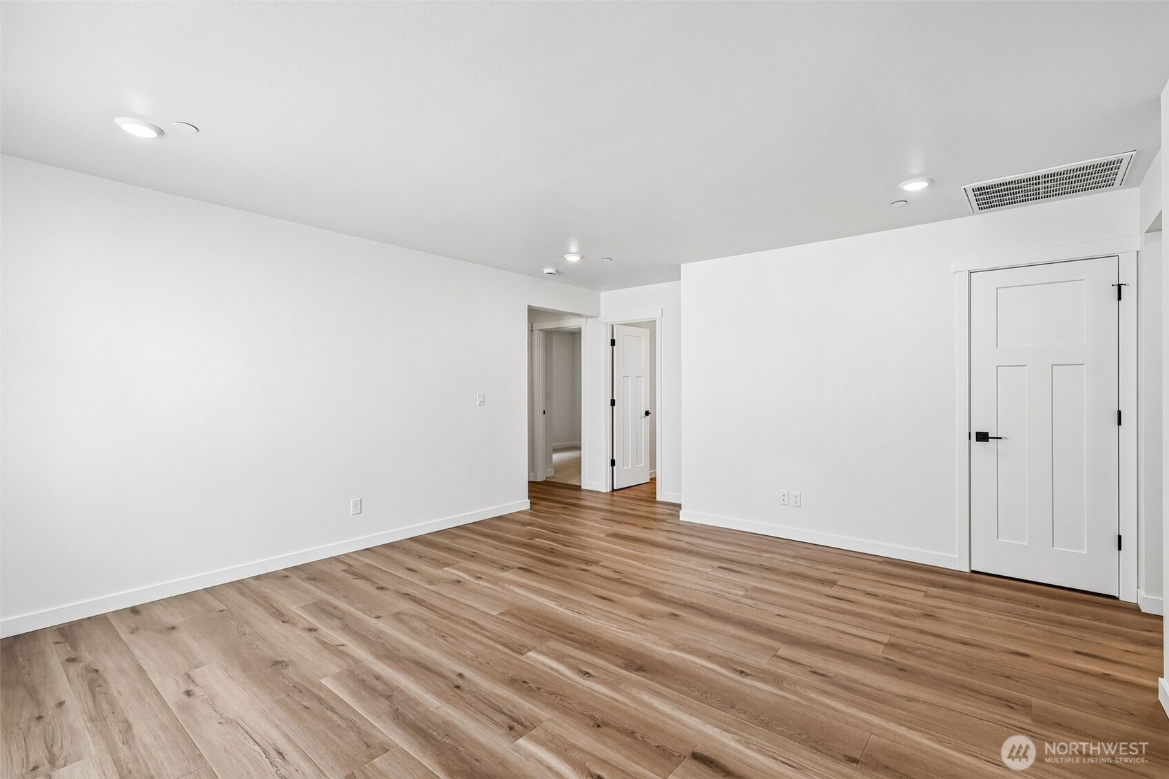 24229 13 Avenue Southeast, Unit CR27 Bothell, WA 98021 - Photo 22 of 40 a view of an empty room with wooden floor