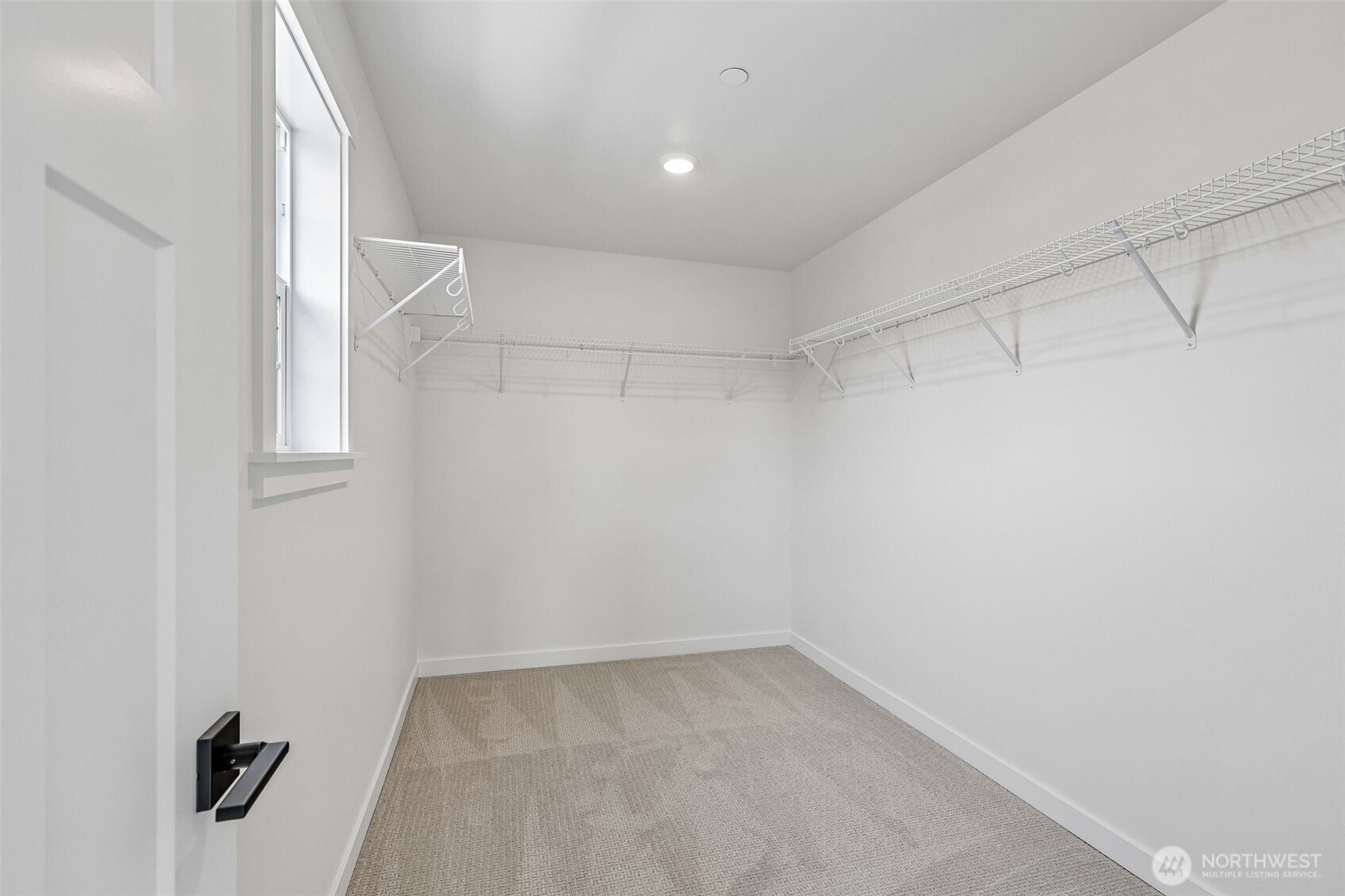 24229 13 Avenue Southeast, Unit CR27 Bothell, WA 98021 - Photo 26 of 40 a view of a room with racks on the wall