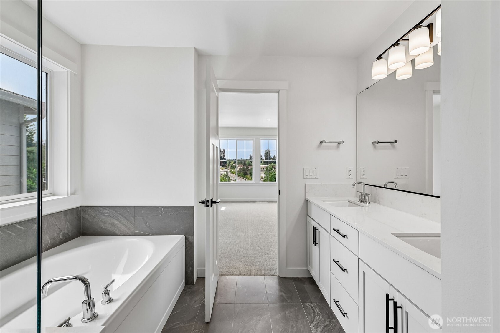 24229 13 Avenue Southeast, Unit CR27 Bothell, WA 98021 - Photo 28 of 40 a bathroom with a tub sink and mirror