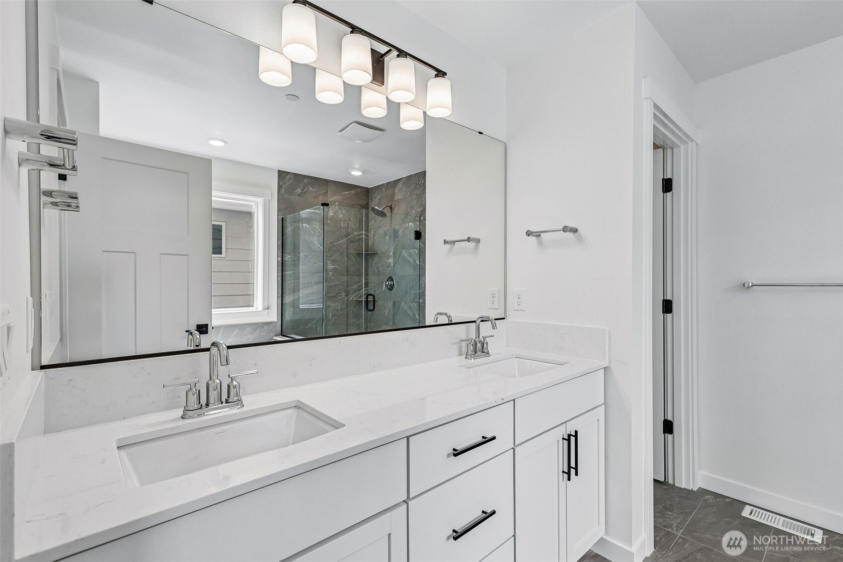 24229 13 Avenue Southeast, Unit CR27 Bothell, WA 98021 - Photo 29 of 40 a bathroom with a sink double vanity and a mirror