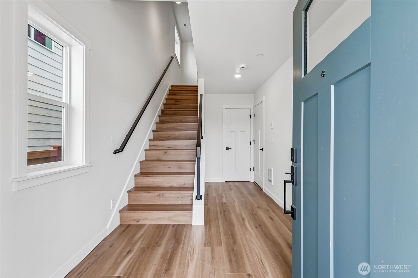 24229 13 Avenue Southeast, Unit CR27 Bothell, WA 98021 - Photo 3 of 40 a view of a hallway with wooden floor and entryway