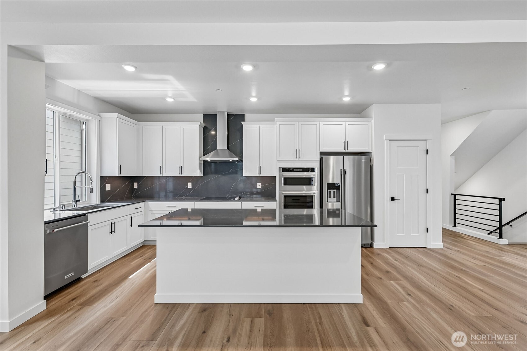 24229 13 Avenue Southeast, Unit CR27 Bothell, WA 98021 - Photo 4 of 40 a large kitchen with stainless steel appliances and a refrigerator