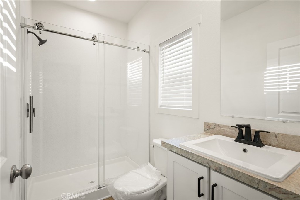 732 East Rte 66, Unit 7 Glendora, CA 91740 - Photo 15 of 15 a bathroom with a sink a toilet and a shower