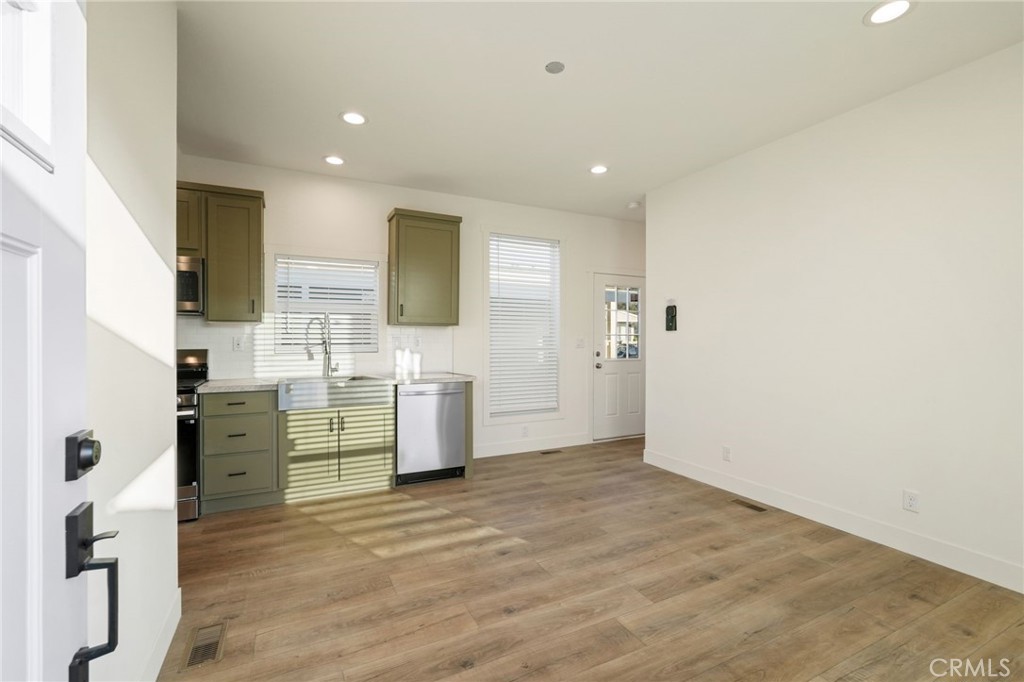 732 East Rte 66, Unit 7 Glendora, CA 91740 - Photo 3 of 15 a view of a kitchen with refrigerator and window