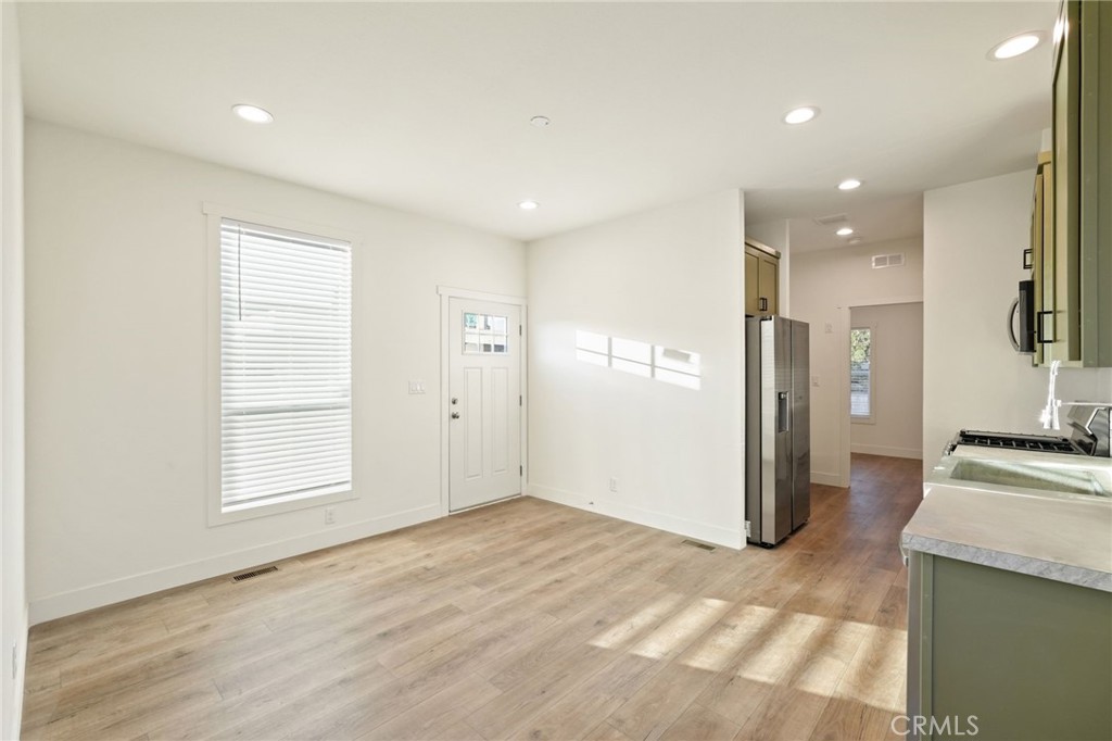 732 East Rte 66, Unit 7 Glendora, CA 91740 - Photo 5 of 15 a view of a kitchen cabinets and wooden floor