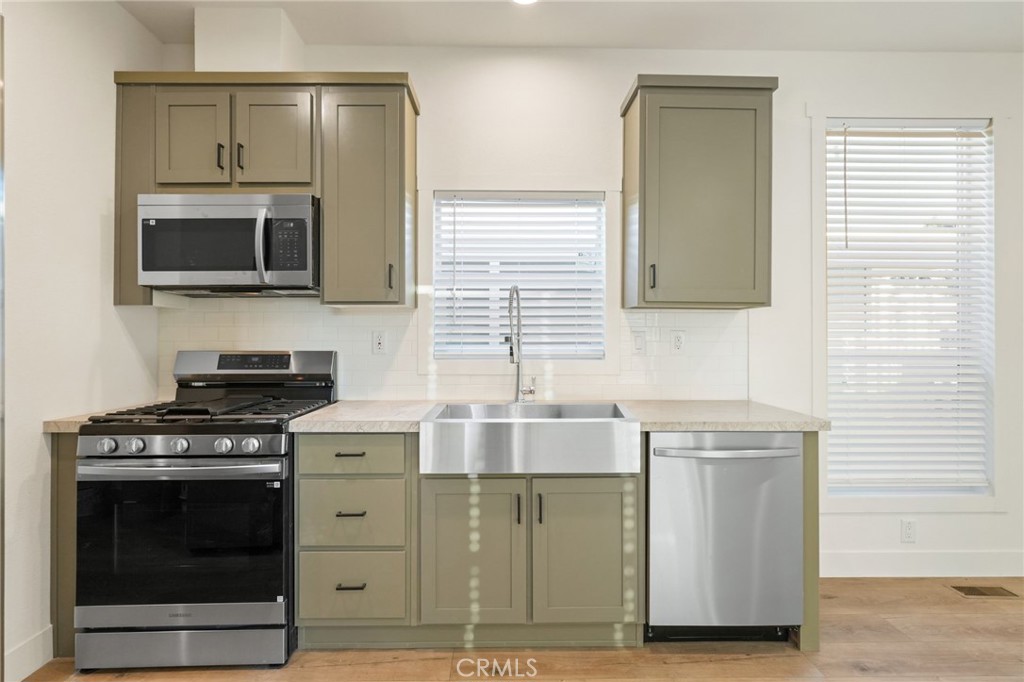 732 East Rte 66, Unit 7 Glendora, CA 91740 - Photo 7 of 15 a kitchen with cabinets and steel stainless steel appliances