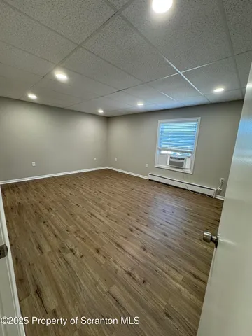 en empty room with wooden floor