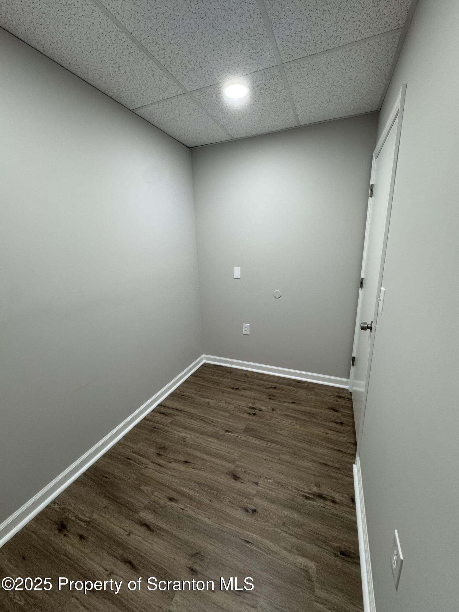 4 Kelly Street, Unit 8 Archbald, PA 18403 - Photo 12 of 16 en empty room with wooden floor