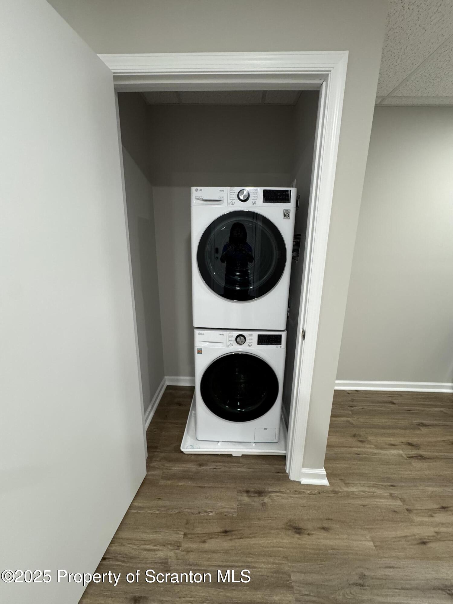 4 Kelly Street, Unit 8 Archbald, PA 18403 - Photo 5 of 16 a view of a hallway with washer and dryer