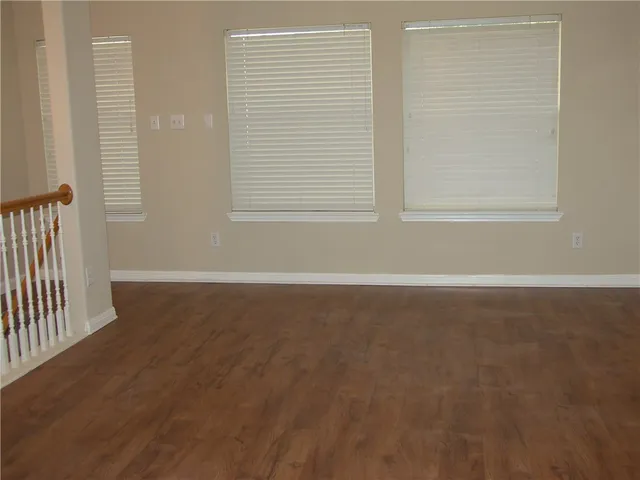 a view of a wooden fence from a balcony