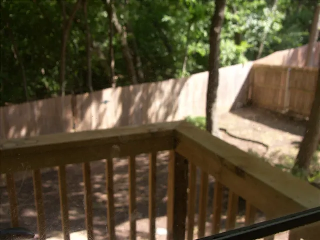 a view of a yard with large trees