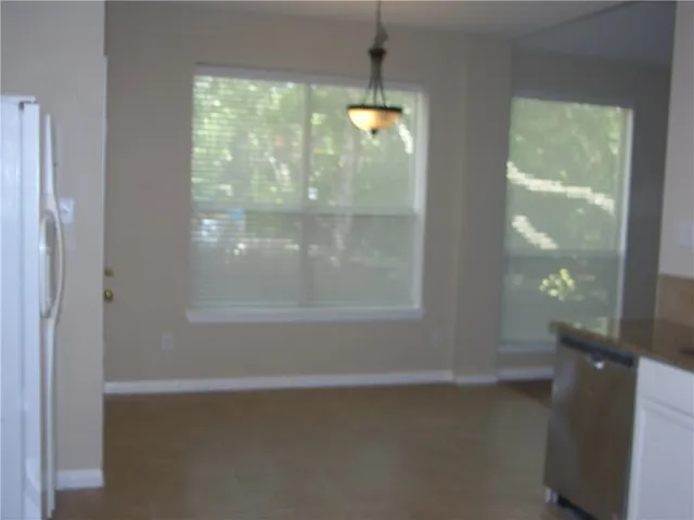 a view of a glass door and a window