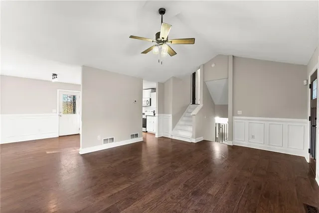 a view of an entryway with wooden floor