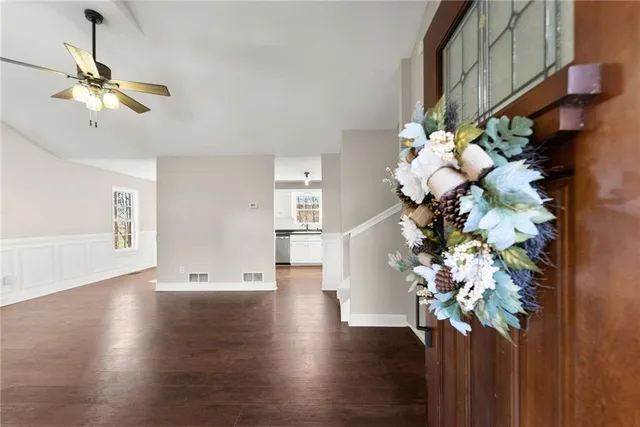 a view of a flowers in a room with a chandelier