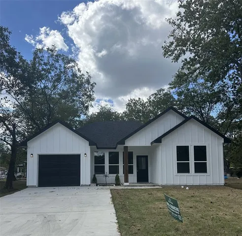 a house with trees in the background