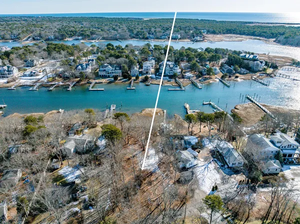 an aerial view of a houses with a yard