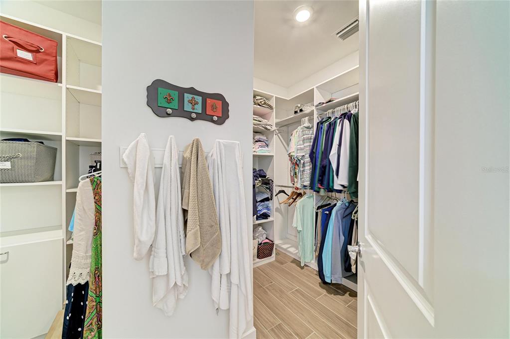 16341 Hidden Oak Loop Lakewood Ranch, FL 34211 - Photo 30 of 76 a view of walk in closet with clothes and shoes