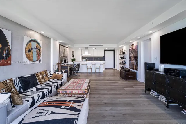 a bathroom with a double vanity sink a large mirror and shower