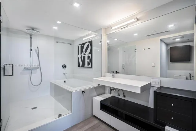 a view of a chairs and table in the balcony