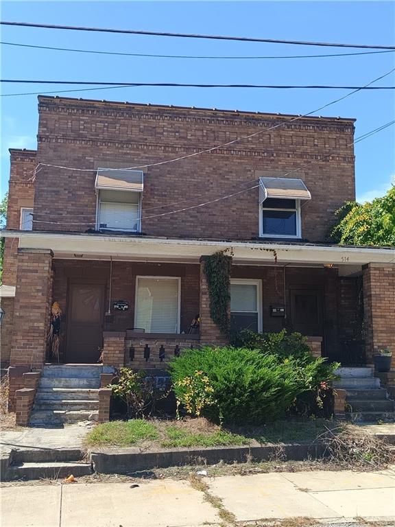 514 Pearson Street New Castle, PA 16101 - Photo 1 of 4 front view of house with a yard