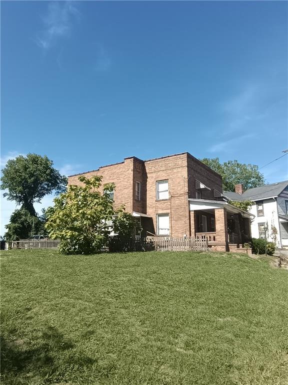 514 Pearson Street New Castle, PA 16101 - Photo 2 of 4 a front view of house with yard