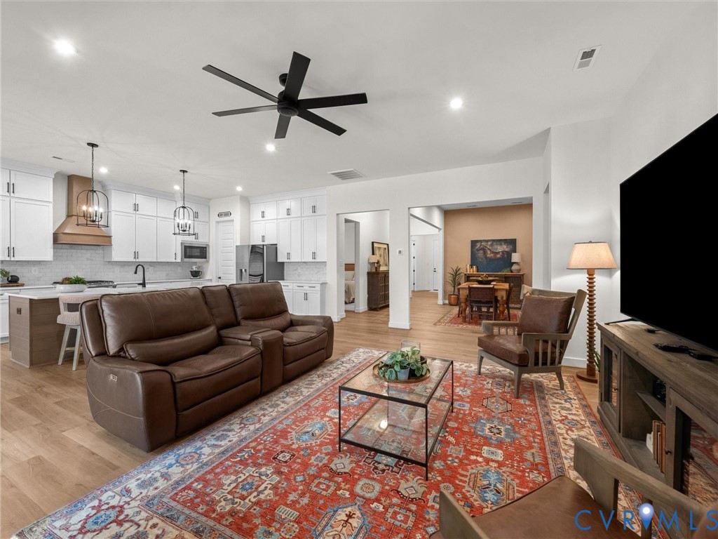 1813 Galley Place Chester, VA 23836 - Photo 12 of 38 Living area featuring a ceiling fan, light wood-ty