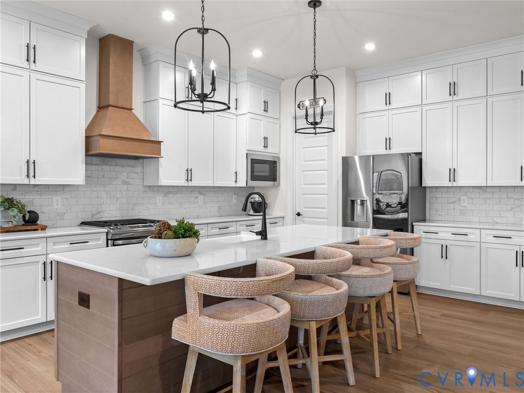 1813 Galley Place Chester, VA 23836 - Photo 13 of 38 Kitchen featuring backsplash, white cabinets, a ki
