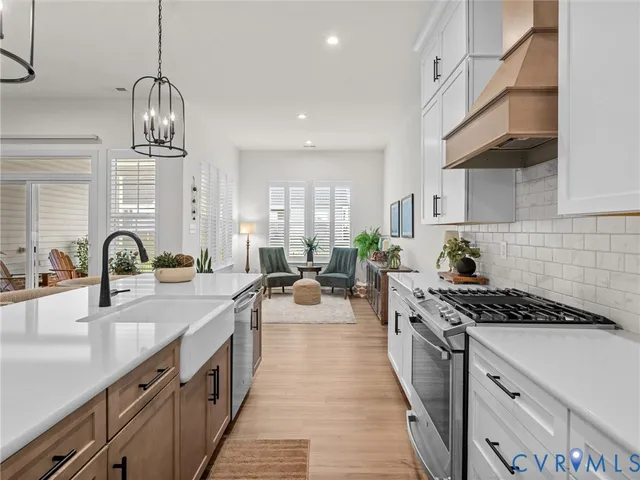a kitchen with a dining table and chairs