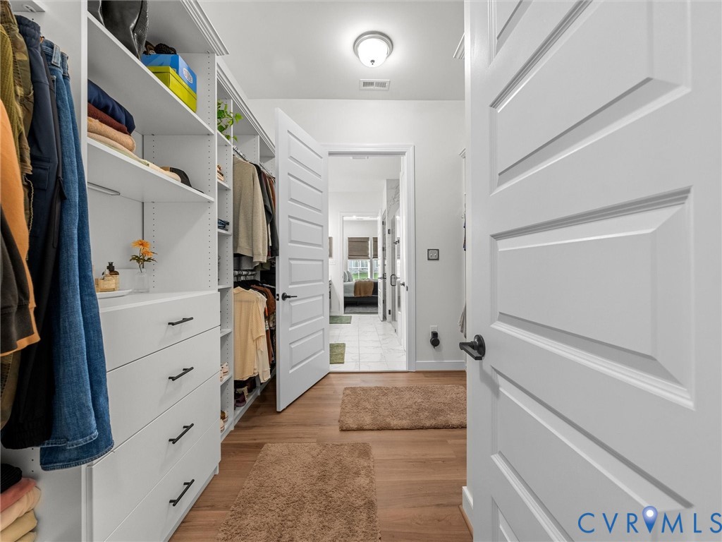 1813 Galley Place Chester, VA 23836 - Photo 25 of 38 Primary closet with light wood-style floors