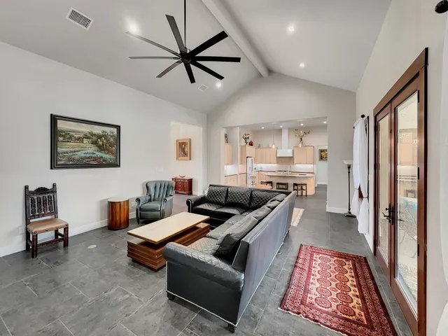 a living room with furniture and a rug