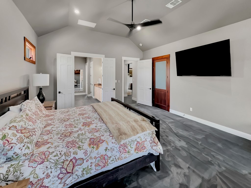 281 Inspiration Loop Comfort, TX 78013 - Photo 20 of 30 a bedroom with a bed window and a flat screen tv