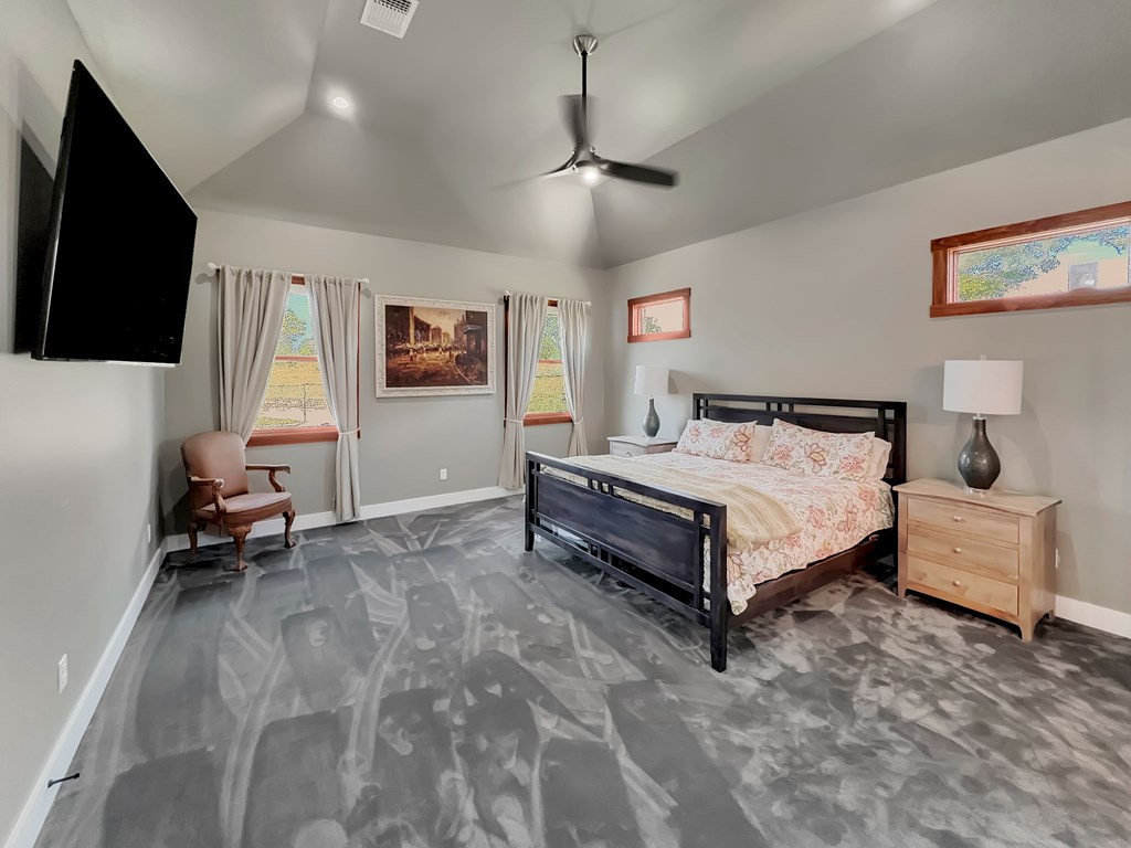 281 Inspiration Loop Comfort, TX 78013 - Photo 21 of 30 a bedroom with a bed and a flat screen tv