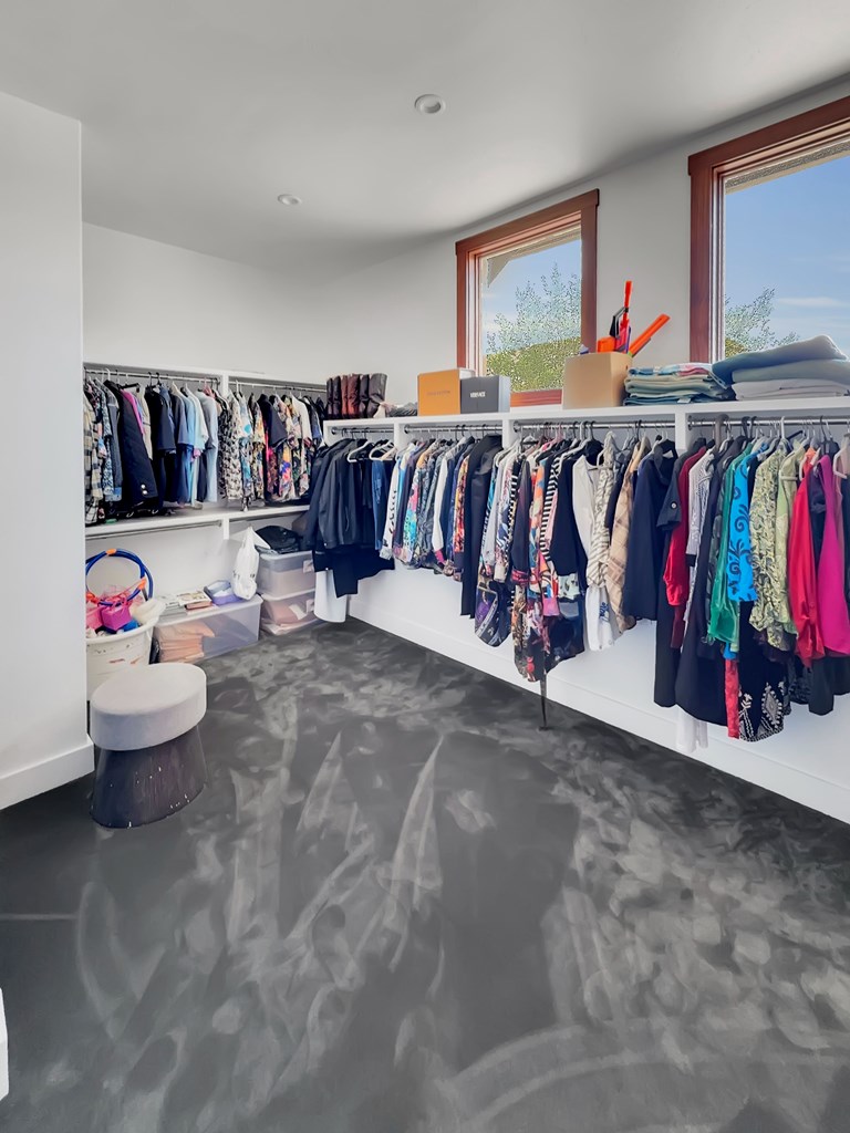 281 Inspiration Loop Comfort, TX 78013 - Photo 25 of 30 a view of a living room with clothes hanging and white walls