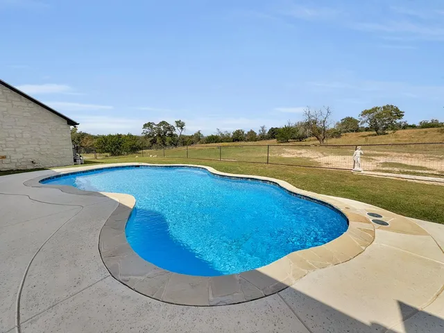 a view of a swimming pool and lake view